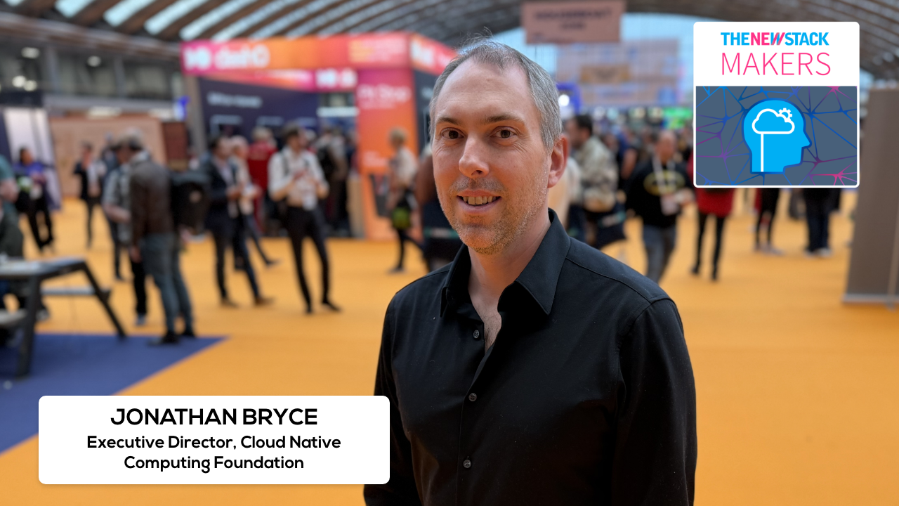 Jonathan Bryce on stage at KubeCon Amsterdam announcing Kubernetes AI conformance certifications